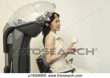 Woman who allots permanent View Large Photo Image Stock Image - Woman who allots permanent. Fotosearch