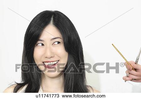 Stock Image - Woman who cuts hair. Fotosearch
