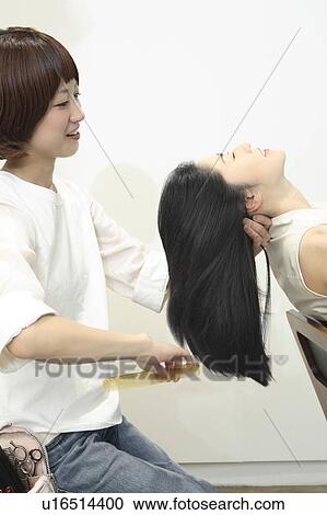 Stock Image - Woman who cuts hair. Fotosearch