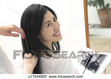 Stock Image - Woman who cuts hair. Fotosearch