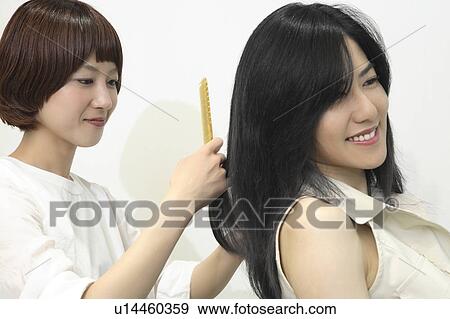 Woman who cuts hair View Large Photo Image Stock Photo - Woman who cuts hair. Fotosearch