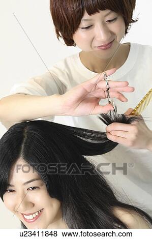 Stock Photo - Woman who cuts hair. Fotosearch