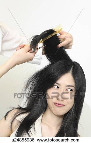 Stock Photograph - Woman who cuts hair. Fotosearch