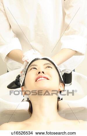 Woman who does a shampoo View Large Photo Image Picture - Woman who does a shampoo. Fotosearch