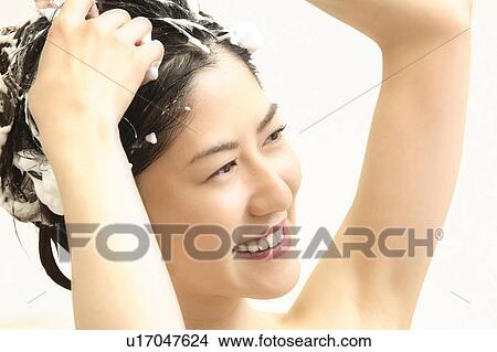 Picture - Woman who does a shampoo. Fotosearch