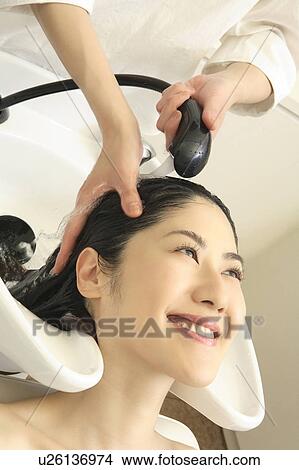 Woman who does a shampoo View Large Photo Image Picture - Woman who does a shampoo. Fotosearch