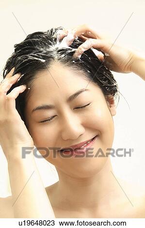 Woman who does a shampoo View Large Photo Image Stock Image - Woman who does a shampoo. Fotosearch