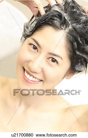 Woman who does a shampoo View Large Photo Image Stock Image - Woman who does a shampoo. Fotosearch