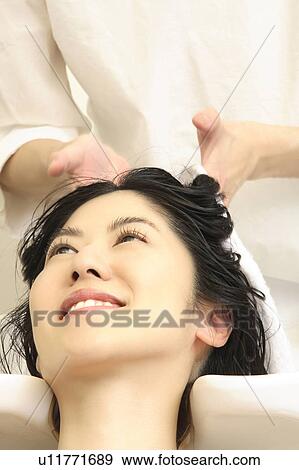Woman who does a shampoo View Large Photo Image Stock Photo - Woman who does a shampoo. Fotosearch