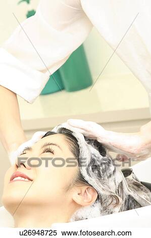 Woman who does a shampoo View Large Photo Image Stock Photography - Woman who does a shampoo. Fotosearch