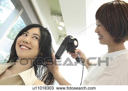 Woman who dries hair View Large Photo Image Stock Image - Woman who dries hair. Fotosearch