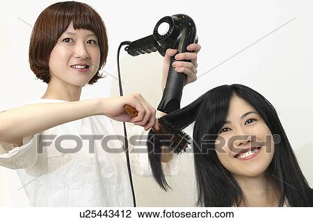 Woman who dries hair View Large Photo Image Stock Image - Woman who dries hair. Fotosearch