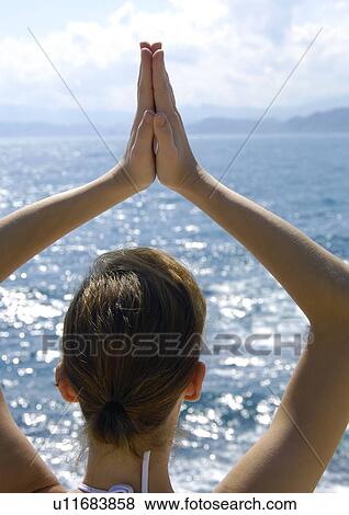 Close-up of a woman practicing yoga View Large Photo Image Stock Photo - Close-up of a woman practicing yoga. Fotosearch