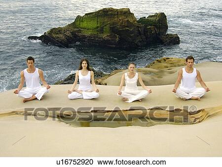 High angle view of two young men and two young women practicing yoga View Large Photo Image Stock Image - High angle view of two young men and two young women practicing yoga. Fotosearch