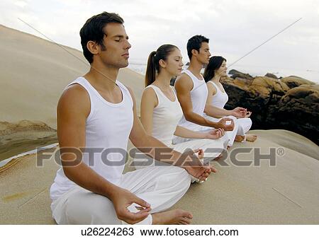 Side profile of two young men and two young women practicing yoga View Large Photo Image Stock Image - Side profile of two young men and two young women practicing yoga. Fotosearch