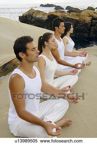 Side profile of two young men and two young women practicing yoga View Large Photo Image Stock Photography - Side profile of two young men and two young women practicing yoga. Fotosearch