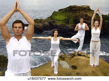 Stock Photo - Two young men and two young women practicing yoga. Fotosearch