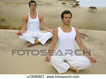 Two young men practicing yoga View Large Photo Image Stock Image - Two young men practicing yoga. Fotosearch