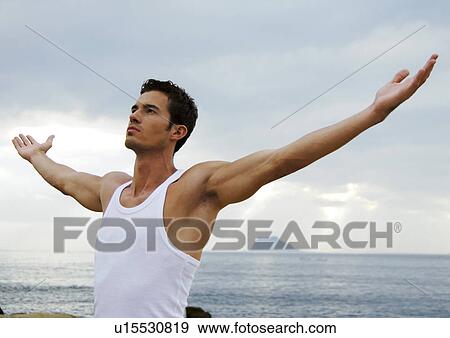 Young man practicing yoga View Large Photo Image Stock Photo - Young man practicing yoga. Fotosearch