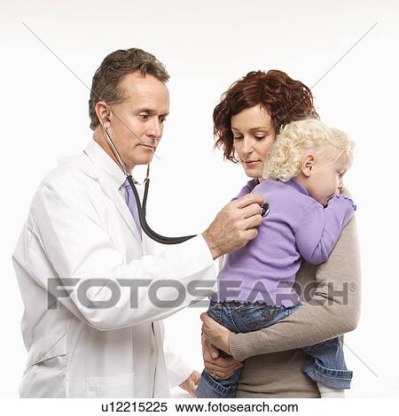 Stock Photography - Middle-aged adult Caucasian male doctor holding stethoscope to female toddler's back with mother watching.. Fotosearch