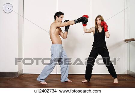 Picture - Straight right-hand punch of Active Tae Bo and inside block. Fotosearch