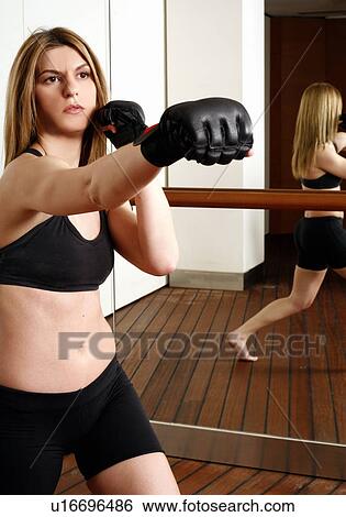Young woman with boxing gloves View Large Photo Image Stock Photograph - Young woman with boxing gloves. Fotosearch