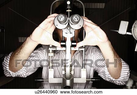Patient at optometrist View Large Photo Image Stock Image - Patient at optometrist. Fotosearch