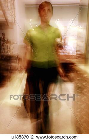 Woman shopping in sunglasses store View Large Photo Image Stock Image - Woman shopping in sunglasses store. Fotosearch