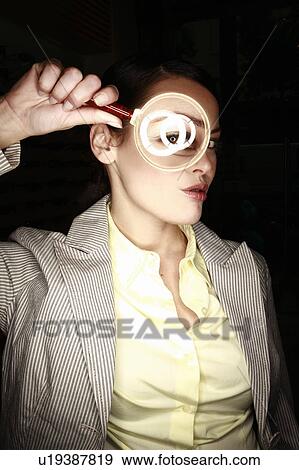 Woman with magnifying glass on eye View Large Photo Image Stock Photo - Woman with magnifying glass on eye. Fotosearch