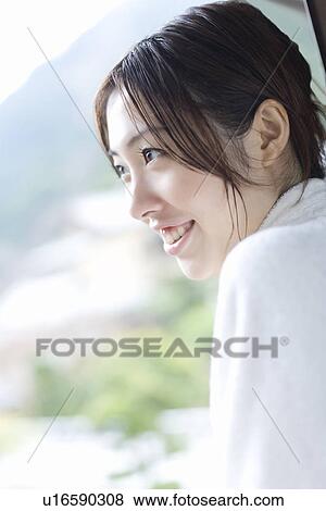 Woman in bathrobe looking at outside from the window, smiling, side view, Japan View Large Photo Image Stock Photo - Woman in bathrobe looking at outside from the window, smiling, side view, Japan. Fotosearch