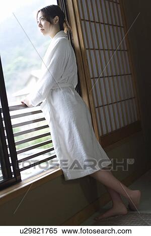 Woman in bathrobe looking outside from the window, side view, Japan View Large Photo Image Stock Photography - Woman in bathrobe looking outside from the window, side view, Japan. Fotosearch
