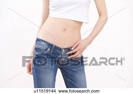 Picture - Woman wearing jeans, front view. Fotosearch