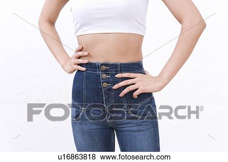 Woman wearing jeans, front view View Large Photo Image Stock Photo - Woman wearing jeans, front view. Fotosearch