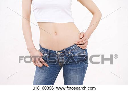 Woman wearing jeans, front view View Large Photo Image Stock Photograph - Woman wearing jeans, front view. Fotosearch