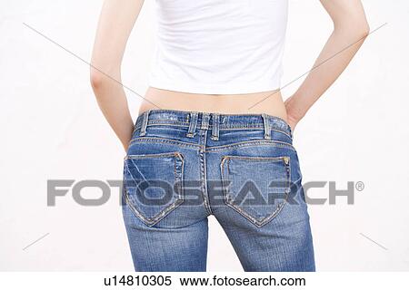 Stock Photography - Woman wearing jeans, rear view. Fotosearch
