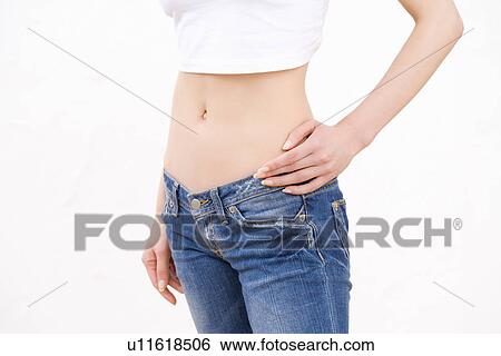 Stock Photograph - Woman wearing jeans, side view. Fotosearch