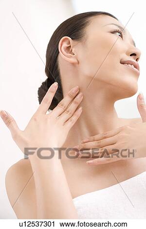 Young woman, smiling, low angle view View Large Photo Image Stock Image - Young woman, smiling, low angle view. Fotosearch