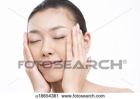 Young woman with eyes closed, close-up, front view View Large Photo Image Stock Image - Young woman with eyes closed, close-up, front view . Fotosearch