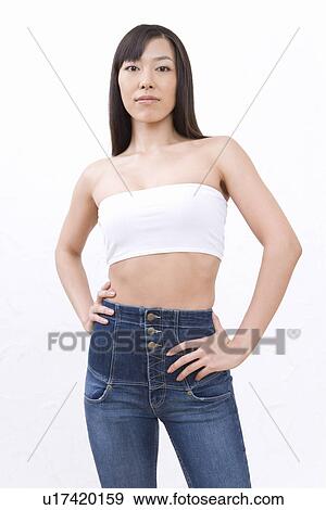 Young woman posing, front view View Large Photo Image Stock Photo - Young woman posing, front view. Fotosearch
