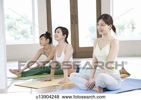 Stock Photo - Young women doing yoga exercise, stretching, three types, side view . Fotosearch