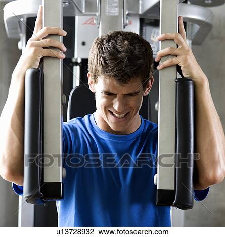 Stock Image - A young man exercising. Fotosearch