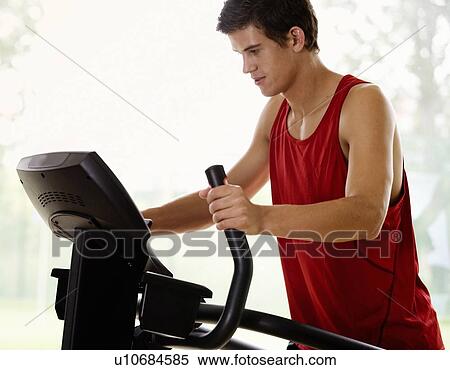 A young man exercising View Large Photo Image Stock Photography - A young man exercising. Fotosearch