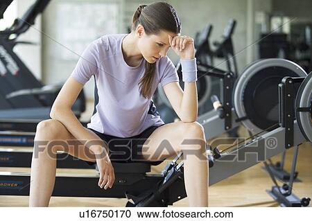 A young woman at a gym View Large Photo Image Stock Image - A young woman at a gym. Fotosearch