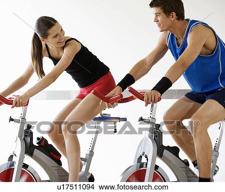 Picture - Two young people exercising. Fotosearch