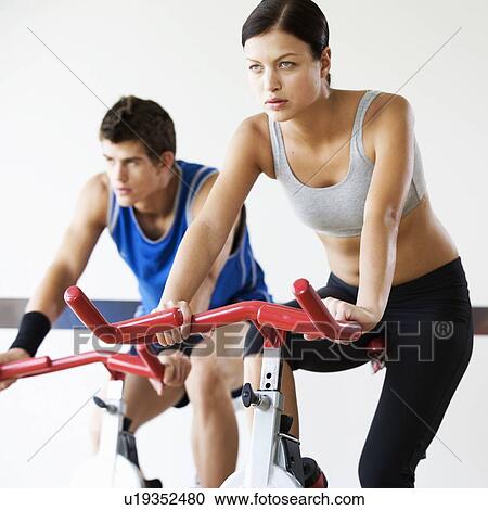 Two young people exercising View Large Photo Image Stock Image - Two young people exercising. Fotosearch