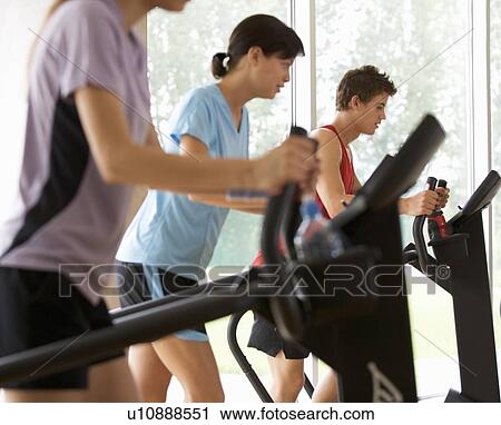 Stock Image - Young people at a gym. Fotosearch