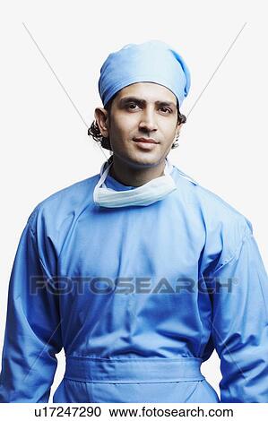Stock Image - Portrait of a male doctor wearing surgical scrubs. Fotosearch