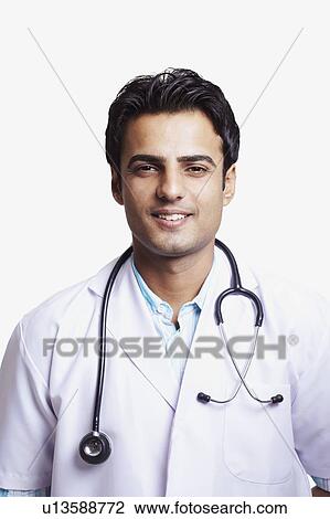 Portrait of a male doctor with a stethoscope around his neck View Large Photo Image Stock Image - Portrait of a male doctor with a stethoscope around his neck. Fotosearch