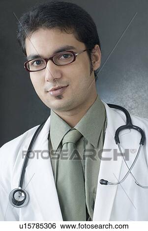Stock Photograph - Portrait of a male doctor with a stethoscope around his neck. Fotosearch