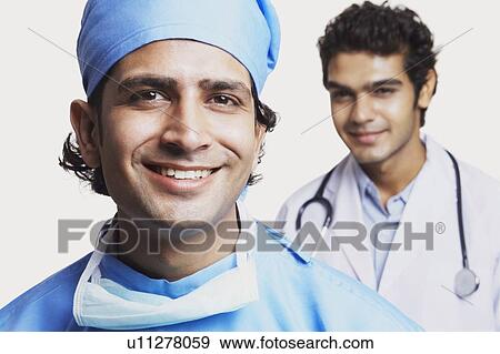Portrait of two male doctors smiling View Large Photo Image Stock Photo - Portrait of two male doctors smiling. Fotosearch